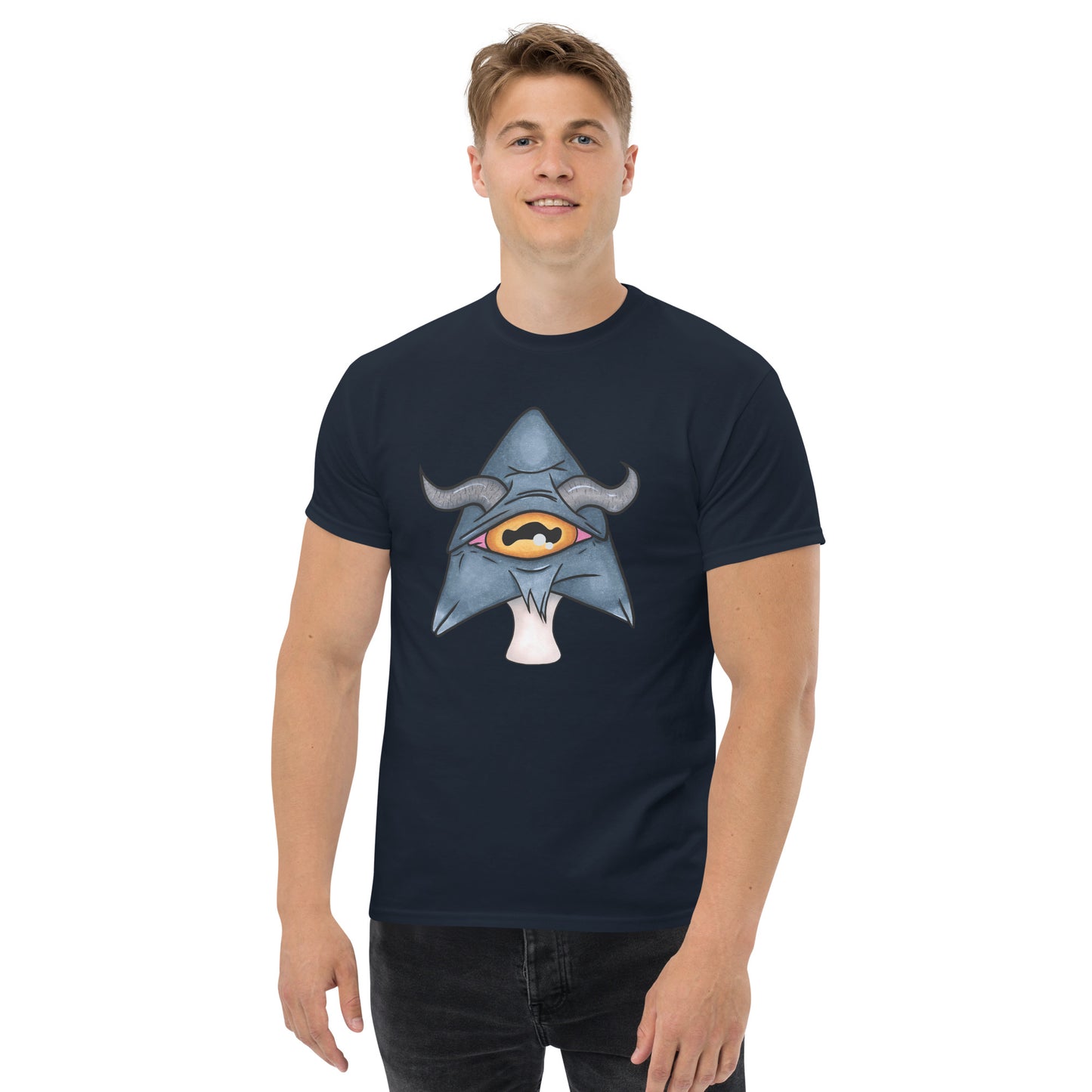 male model wears navy mens tee featuring a trippy grey goat mushroom design with one yellow eye