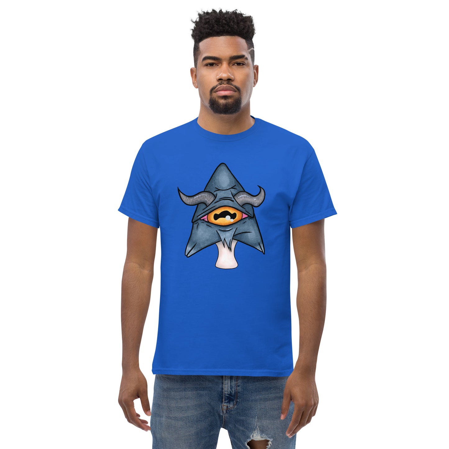 male model wears royal blue mens tee featuring a trippy grey goat mushroom design with one yellow eye