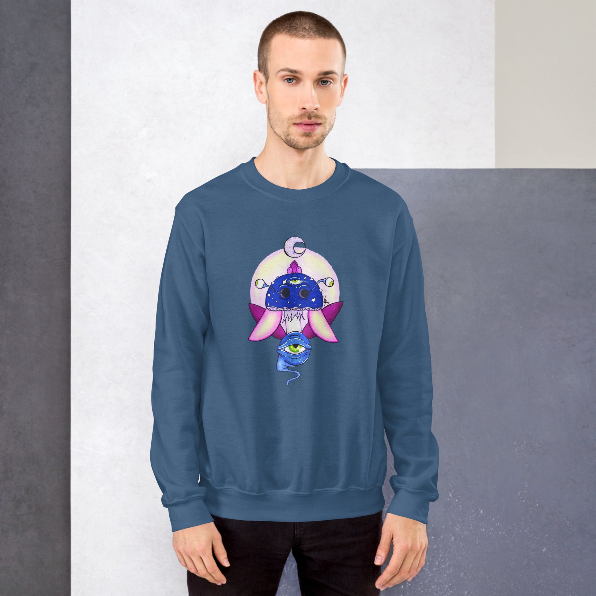 male model wears Unisex indigo blue crew neck sweatshirt with mystical print featuring a multi-eyed mushroom, insect wings, and a watchful eye.