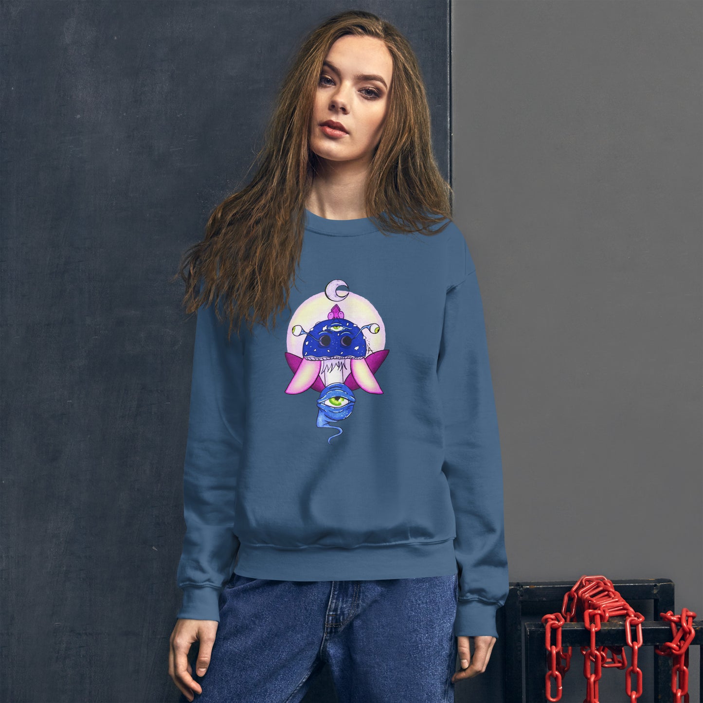 female model wears Unisex indigo blue crew neck sweatshirt with mystical print featuring a multi-eyed mushroom, insect wings, and a watchful eye.