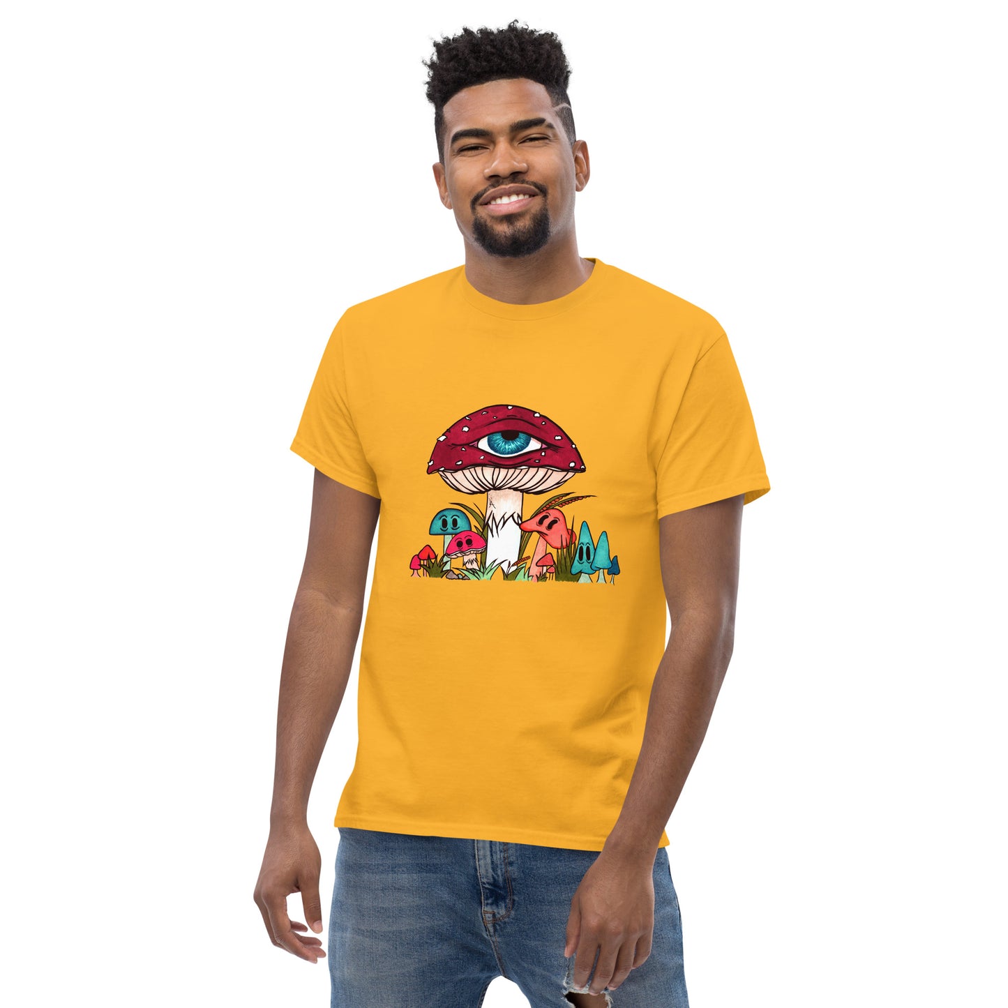 male wears gold tshirt red and white toadstool mushroom with all seeing eye smaller surrounding blue orange and red mushrooms