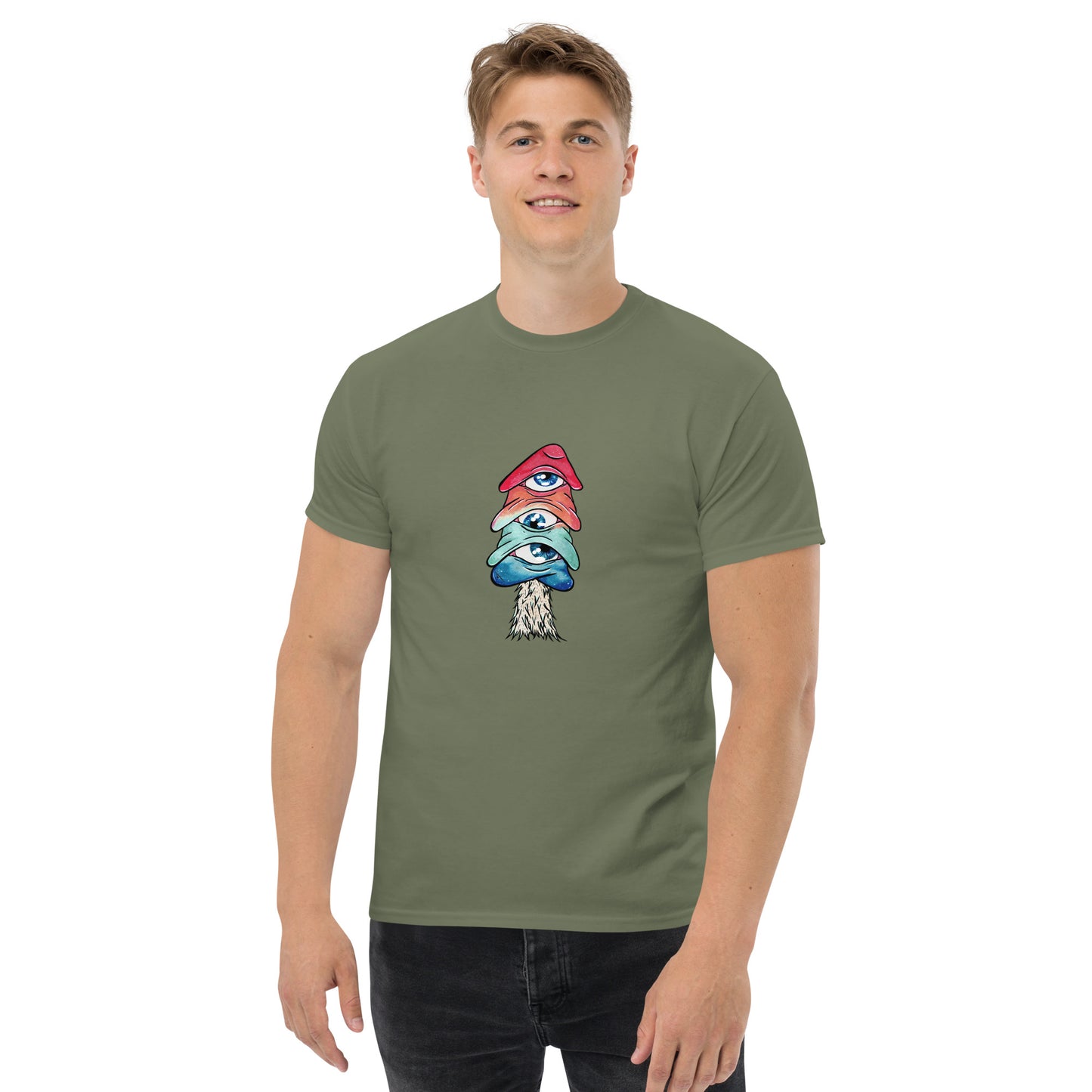 male wears military green crew neck tshirt mushroom with 3 eyes in pink green and blue