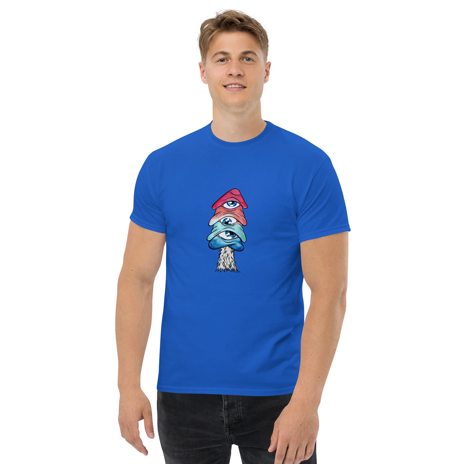 male model wears royal blue crew neck tshirt mushroom with 3 eyes in pink green and blue 