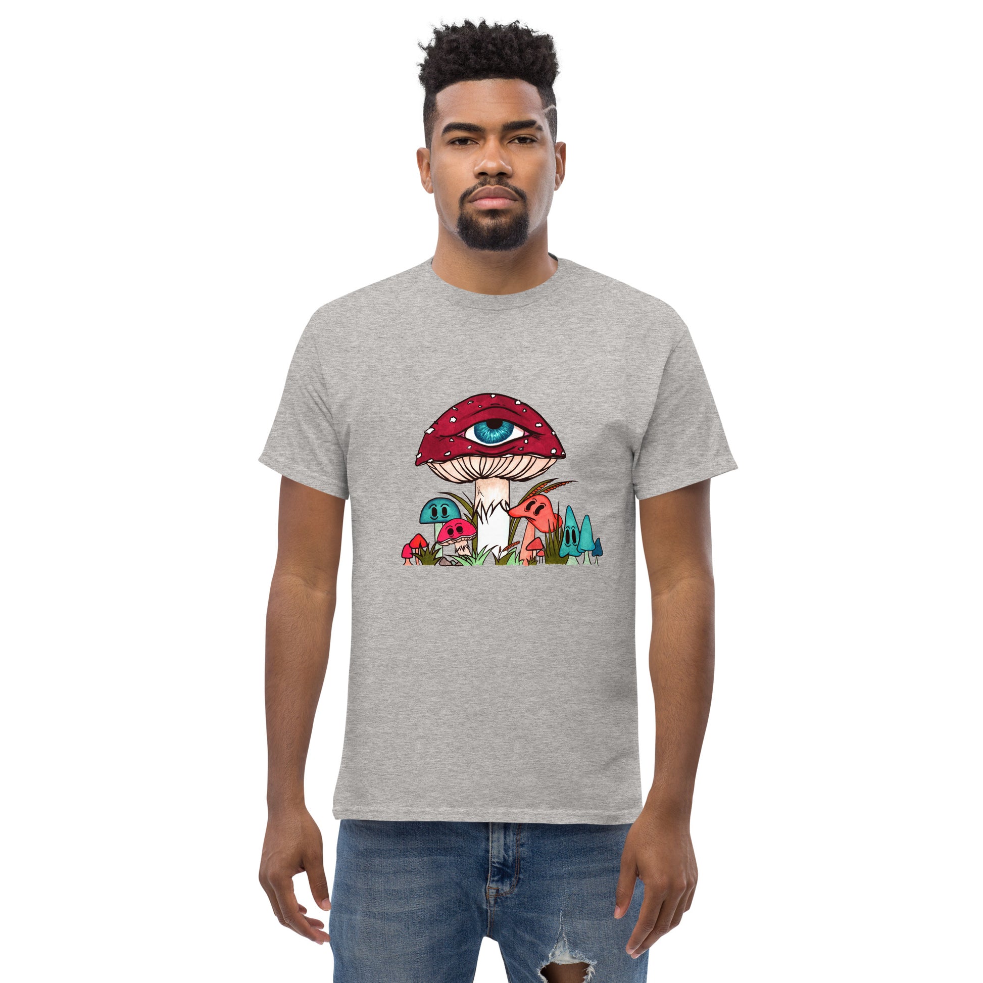 male wears sport grey tshirt red and white toadstool mushroom with all seeing eye smaller surrounding blue orange and red mushrooms