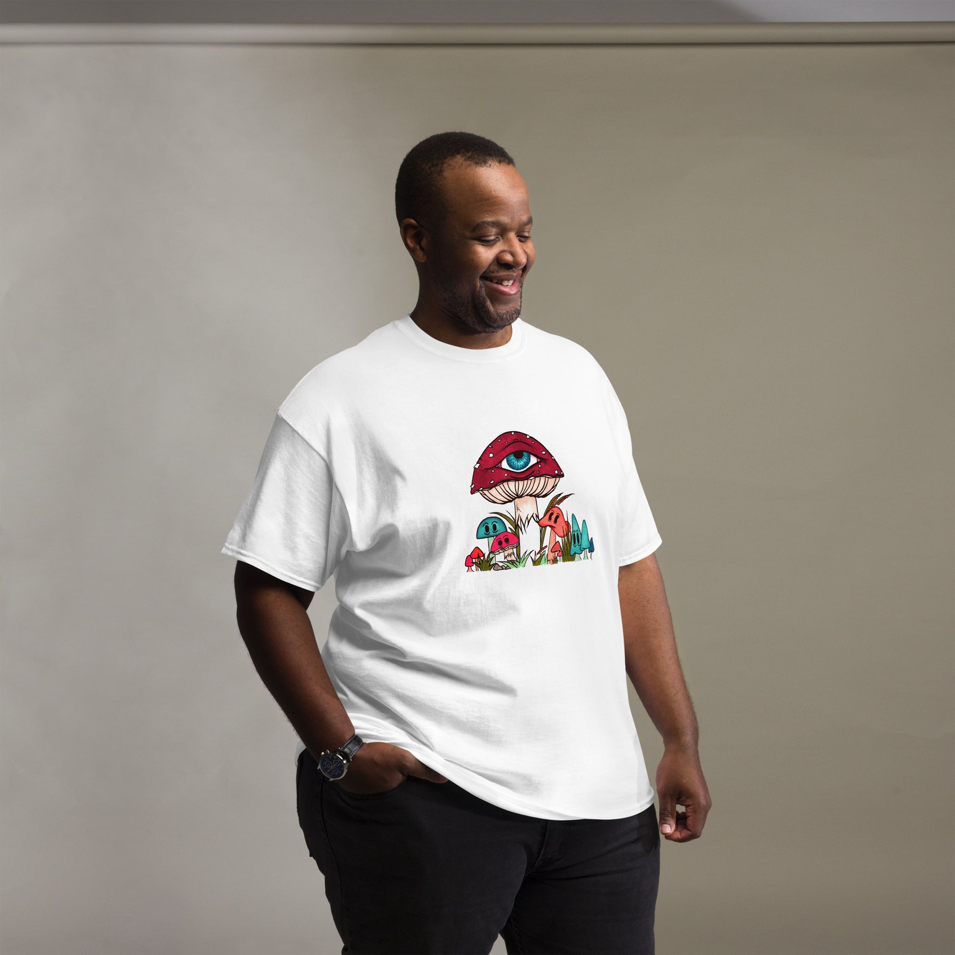 male wears white tshirt red and white toadstool mushroom with all seeing eye smaller surrounding blue orange and red mushrooms