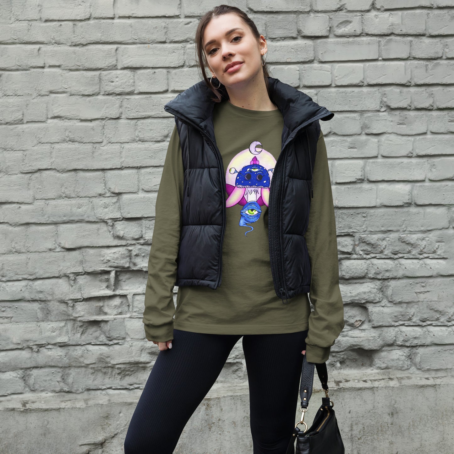 female wears military green long sleeve tee psychedelic toadstool mushroom with eyes full moon crescent moon flying insect in winter blue and purple