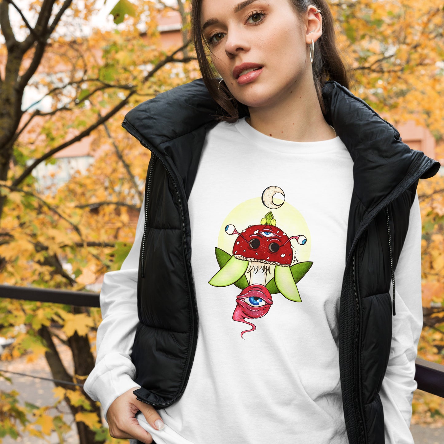 female wears white long sleeve t-shirt psychedelic toadstool mushroom with eyes full moon crescent moon flying insect