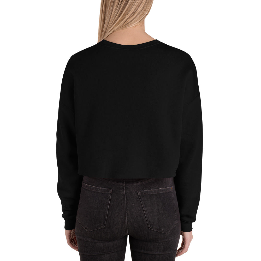 female wears black crop sweatshirt back view