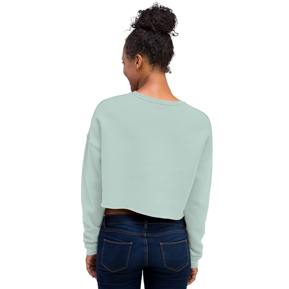 female wears dusty blue crop sweatshirt back view