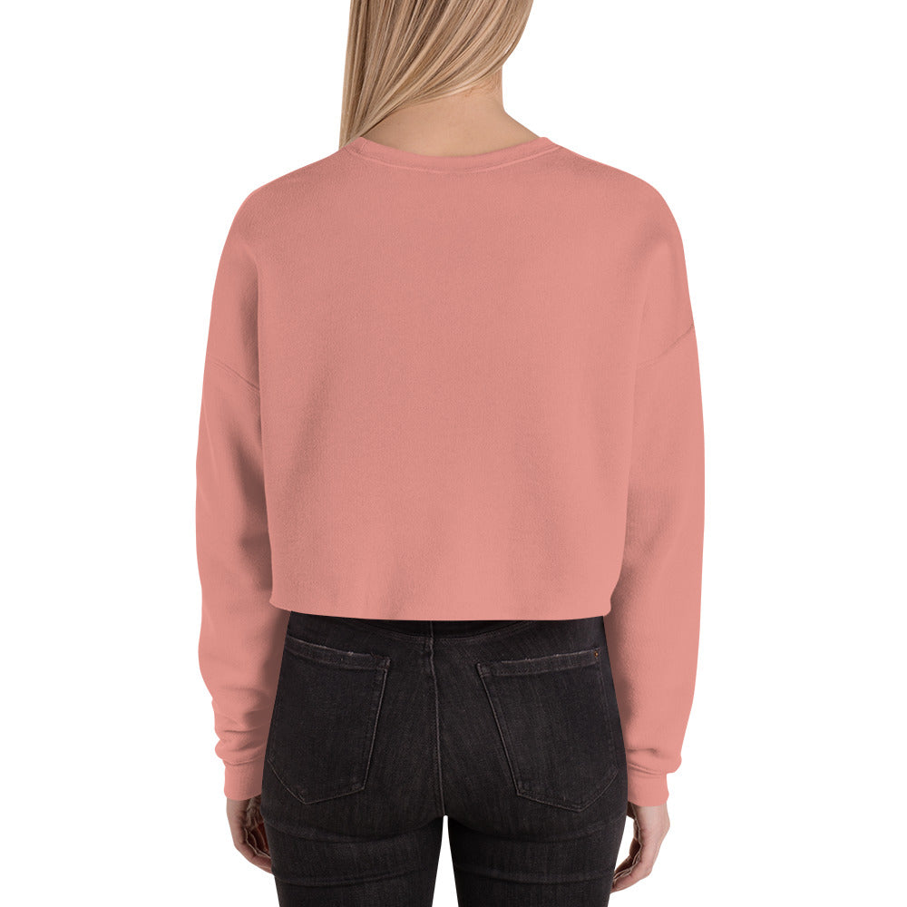 female wears black crop sweatshirt back view